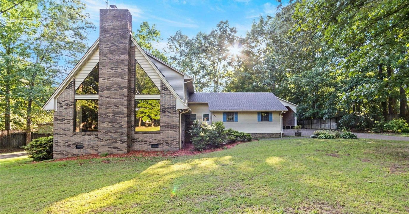 This full-brick home in a quiet country club neighborhood is...
